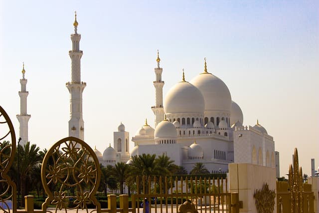The white domes and minarets of the Sheikh Zayed Grand Mosque in Abu Dhabi
