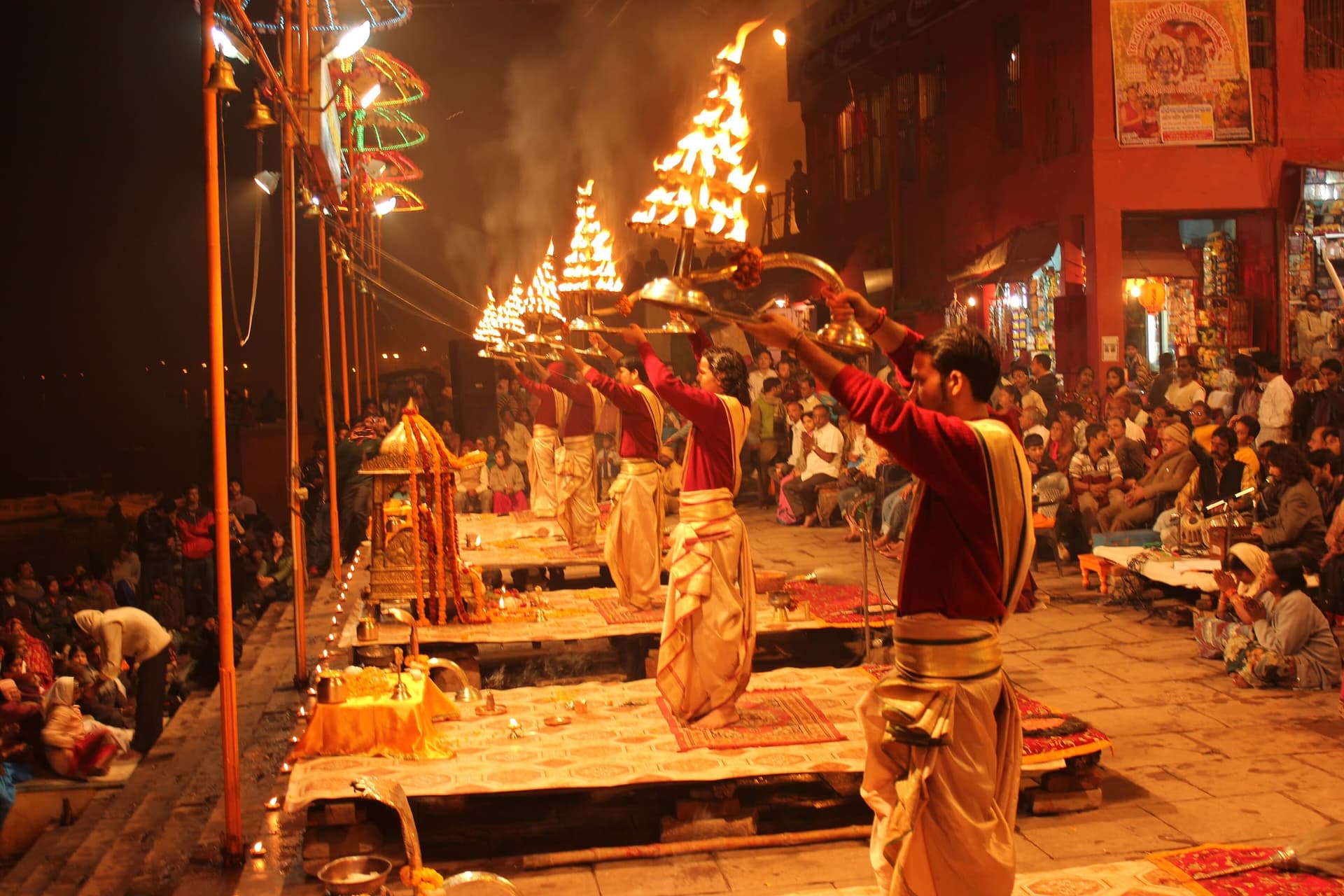 Priests performing the evening Ganga Aarti with lamps at Dashashwamedh Ghat, Varanasi