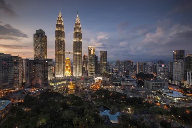 The Petronas Twin Towers rising over Kuala Lumpur