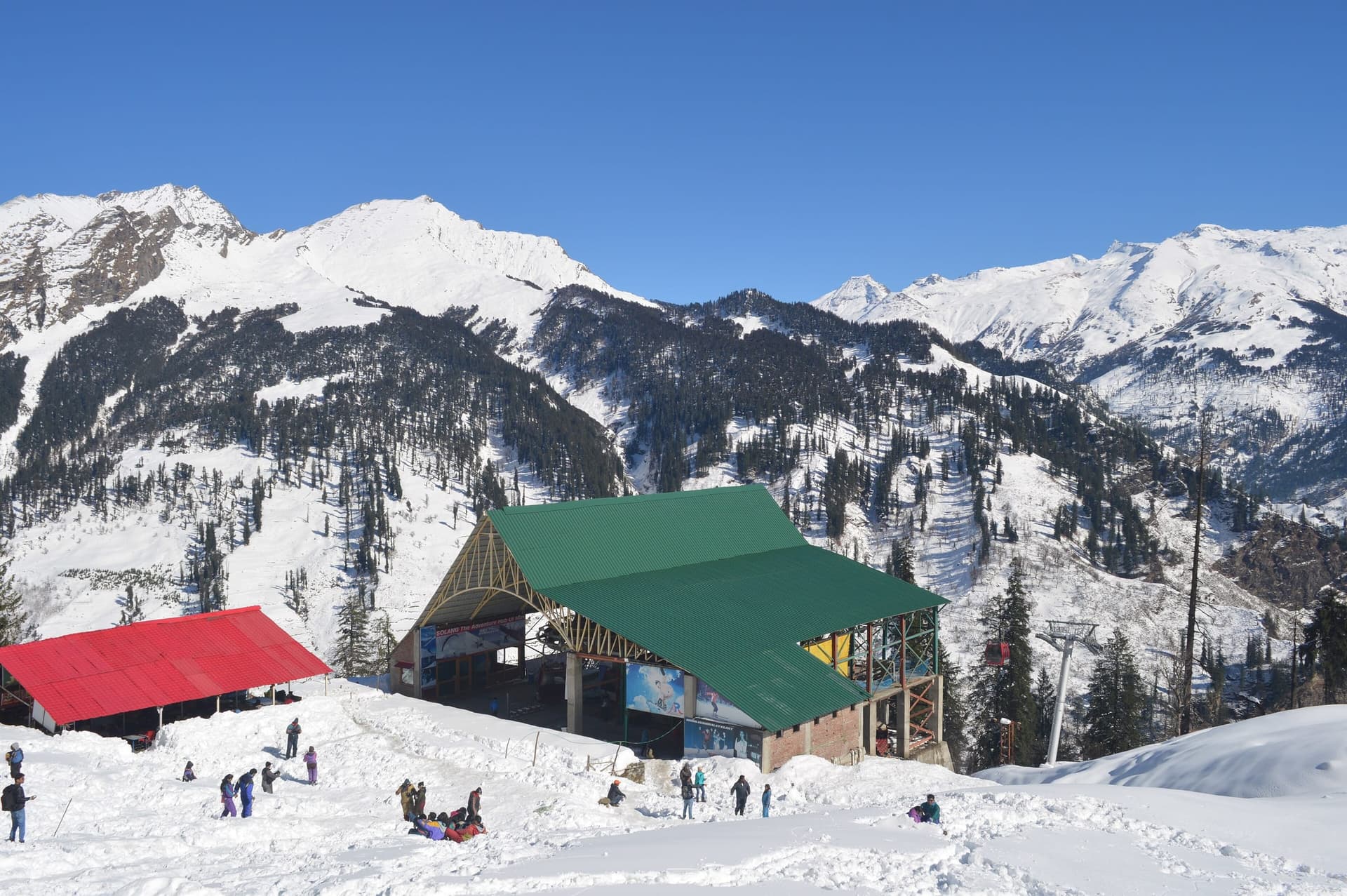 Snow-dusted Himalayan peaks rising above the pine forests around Manali in Himachal Pradesh