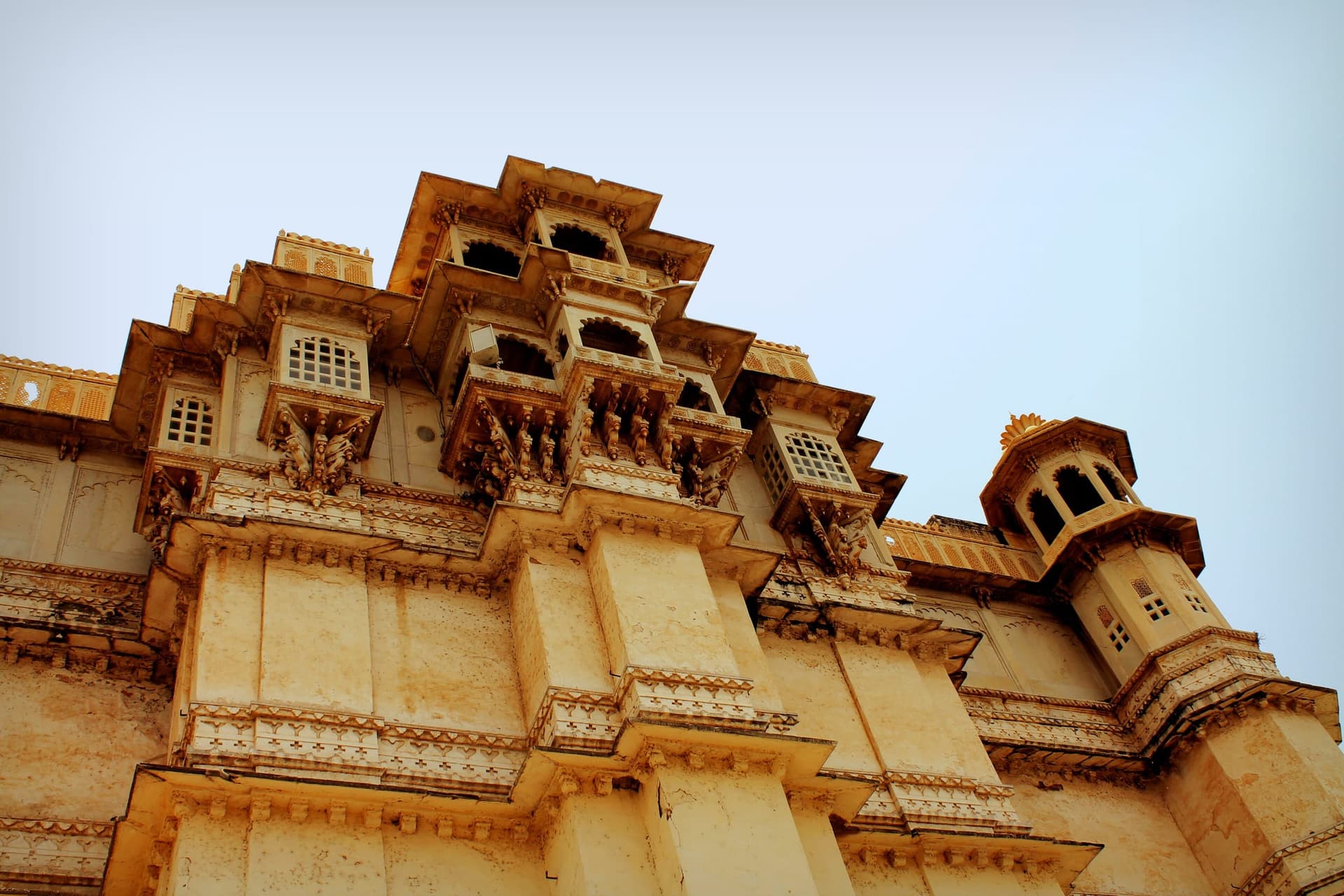 A floodlit Rajasthan heritage palace, emblematic of luxury travel in India