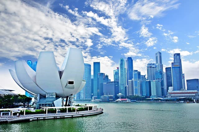 The Marina Bay skyline of Singapore lit up at dusk