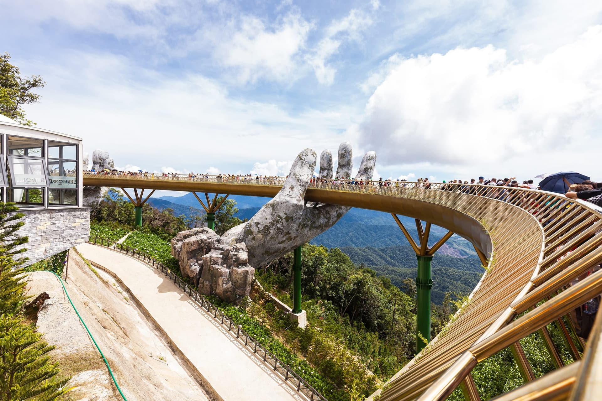 The Golden Hand Bridge held aloft by giant stone hands at Ba Na Hills