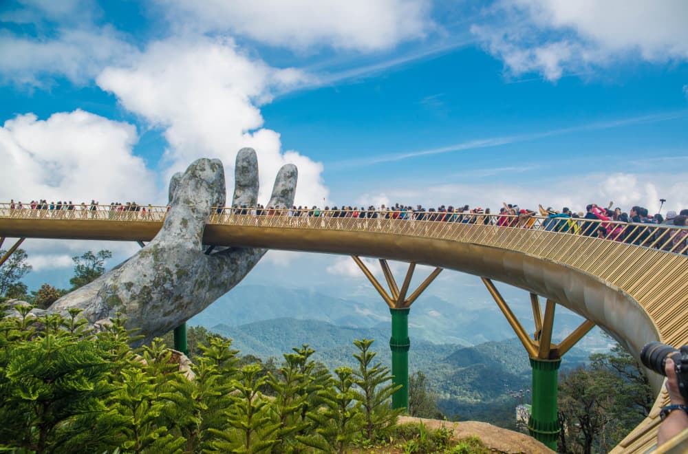 The Golden Hand Bridge held aloft by giant stone hands at Ba Na Hills