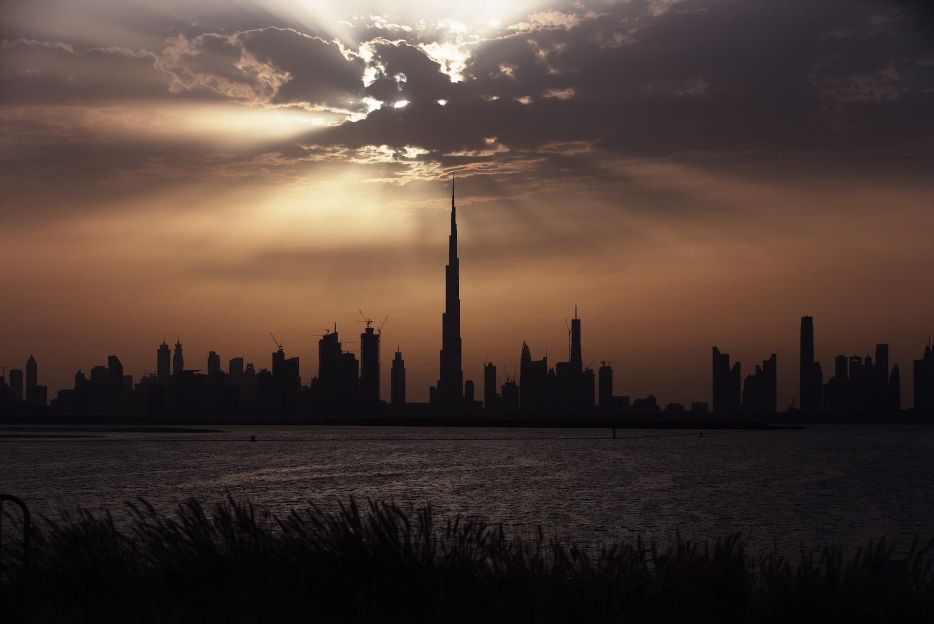 The Burj Khalifa towering over the Dubai skyline at dusk