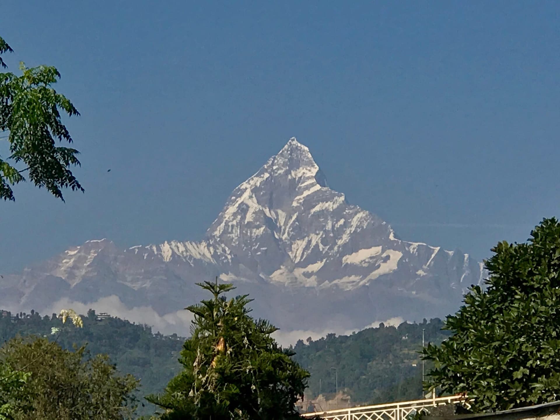 Snow-capped Himalayan peaks rising beyond the Nepalese foothills