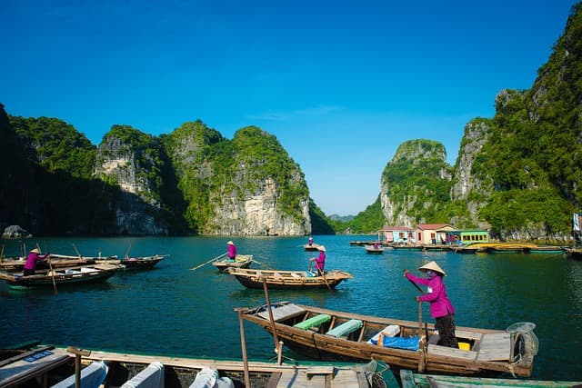 Limestone karsts rising from the emerald water of Halong Bay
